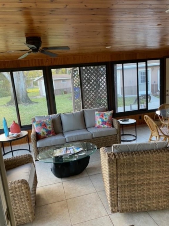 125 Main Street Sebastian, FL 32958 - Photo 14 of 25 a living room with furniture and a floor to ceiling window