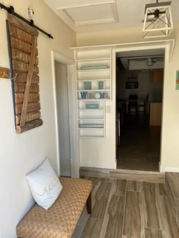 a view of a bedroom with furniture and closet