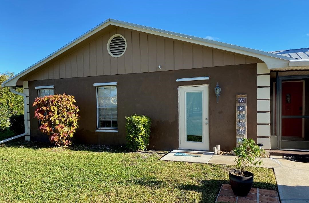 125 Main Street Sebastian, FL 32958 - Photo 2 of 25 a front view of a house with garden