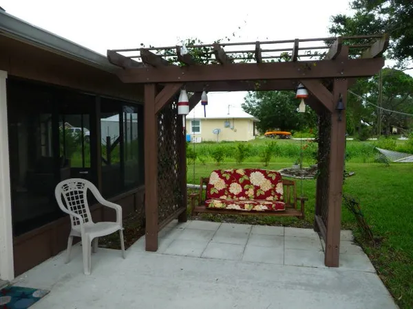 a wooden bench sitting in front of a building