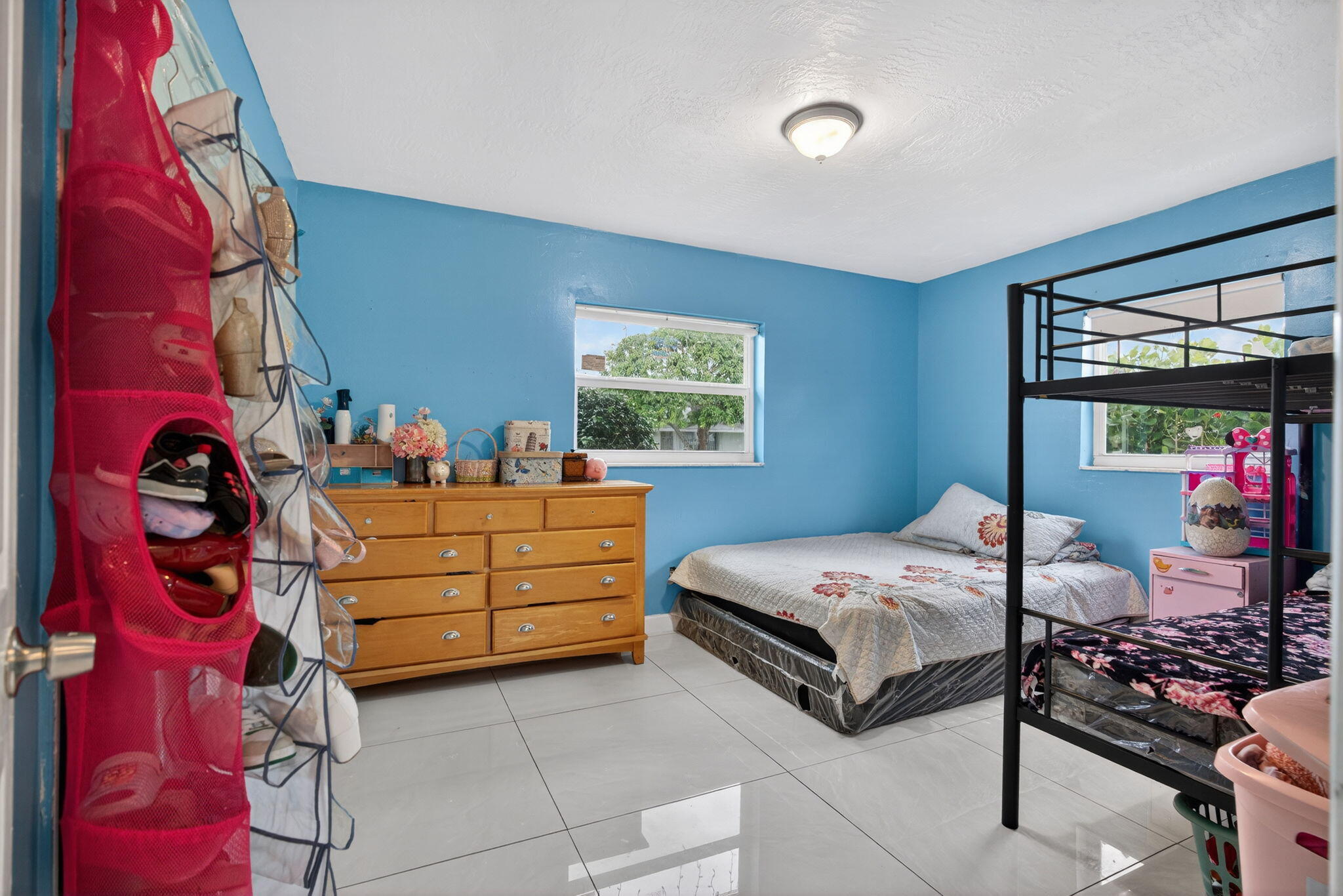 304 Kennedy Street Jupiter, FL 33458 - Photo 15 of 32 a bedroom with a bed and a window