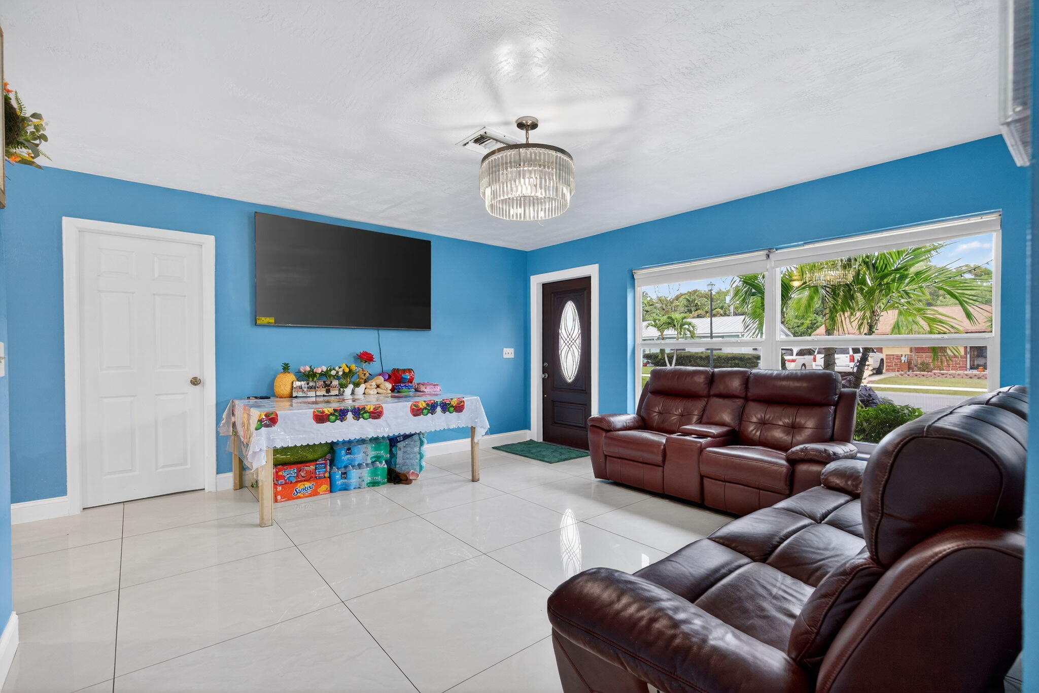 304 Kennedy Street Jupiter, FL 33458 - Photo 5 of 32 a living room with furniture and a flat screen tv