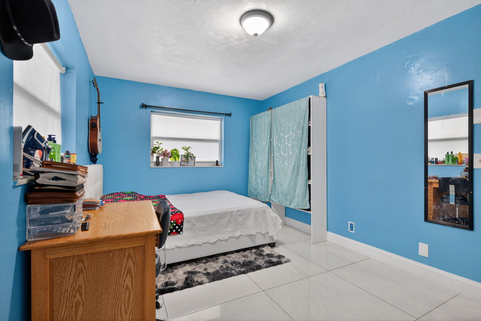 304 Kennedy Street Jupiter, FL 33458 - Photo 10 of 32 a bedroom with a bed and a couch