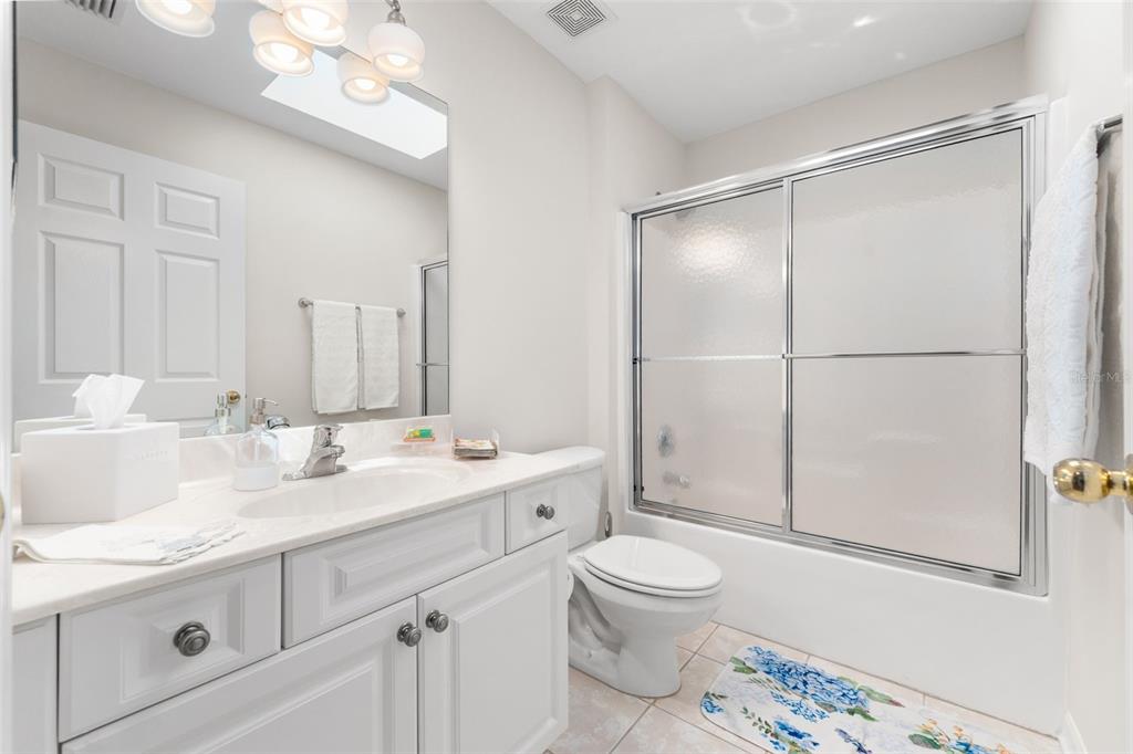 7418 White Oaks Road Alachua, FL 32615 - Photo 23 of 46 a bathroom with a sink a toilet and shower
