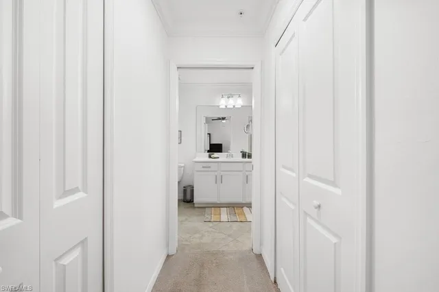 a bathroom with a sink a mirror and vanity
