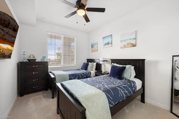 a bedroom with a bed and window