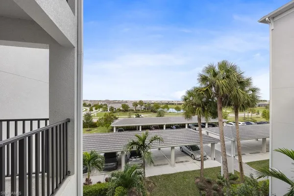 a roof deck with table and chairs potted plants with sky view