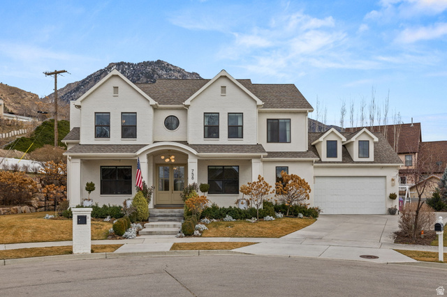 758 East 3030th Street North Provo, UT 84604 - Photo 1 of 1 Traditional-style house with covered porch, driveway, roof with shingles, french doors, and a mountain view