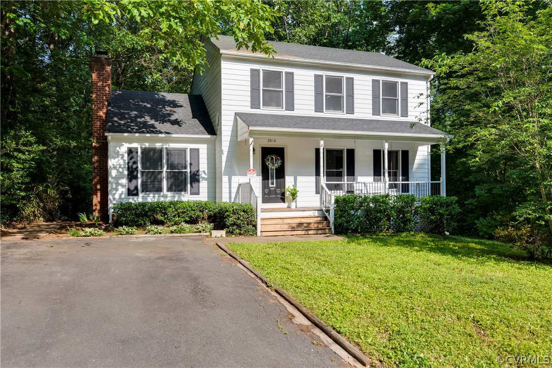 2618 Brookforest Road Midlothian, VA 23112 - Photo 1 of 29 a front view of a house with a yard and porch