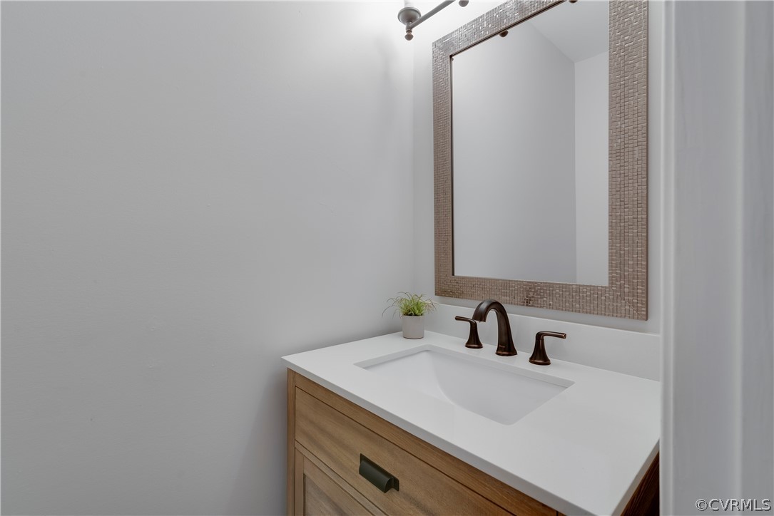 2618 Brookforest Road Midlothian, VA 23112 - Photo 16 of 29 a bathroom with a sink and a mirror