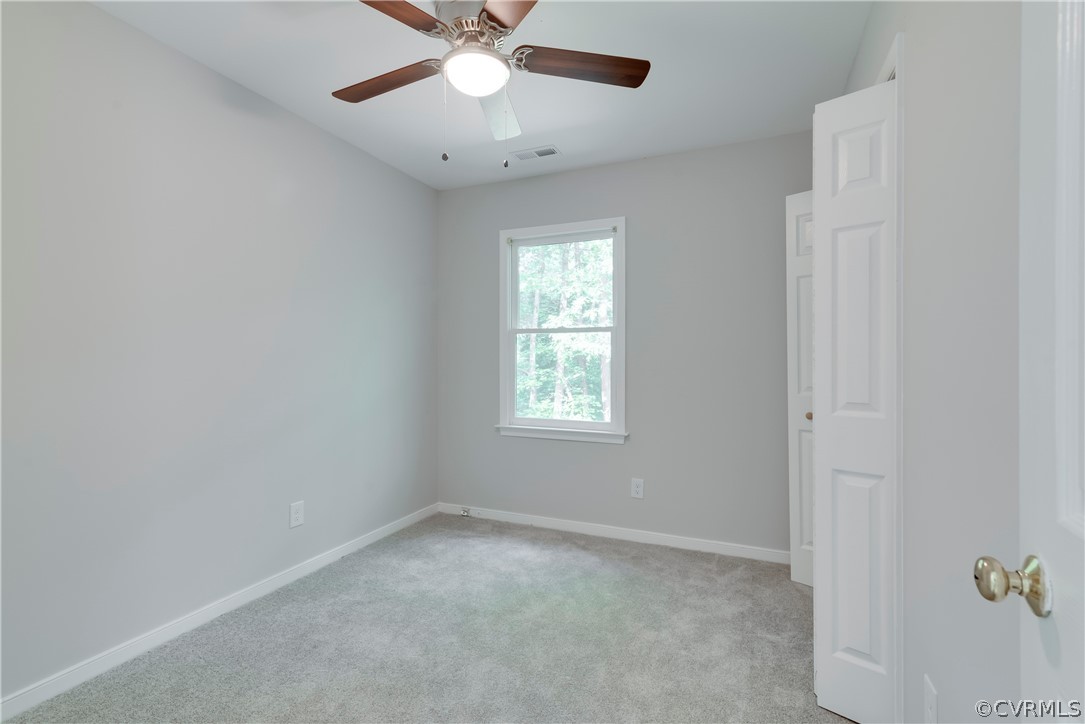 2618 Brookforest Road Midlothian, VA 23112 - Photo 17 of 29 an empty room with a window and a fan