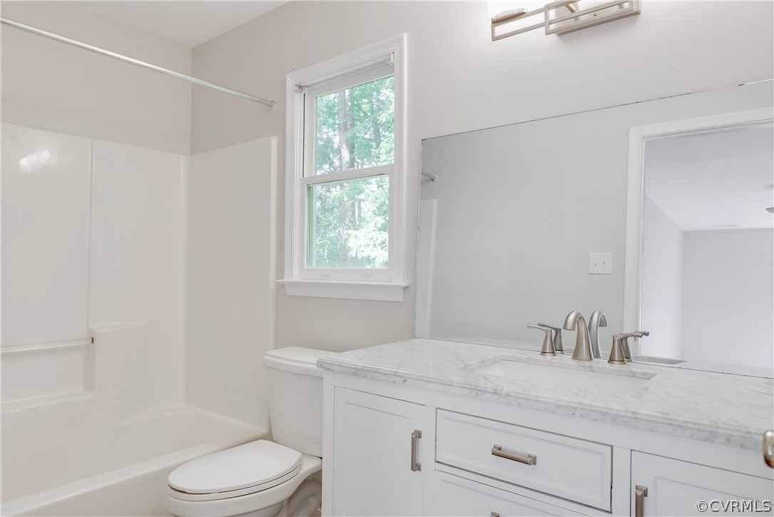 2618 Brookforest Road Midlothian, VA 23112 - Photo 25 of 29 a bathroom with a granite countertop sink a toilet and shower