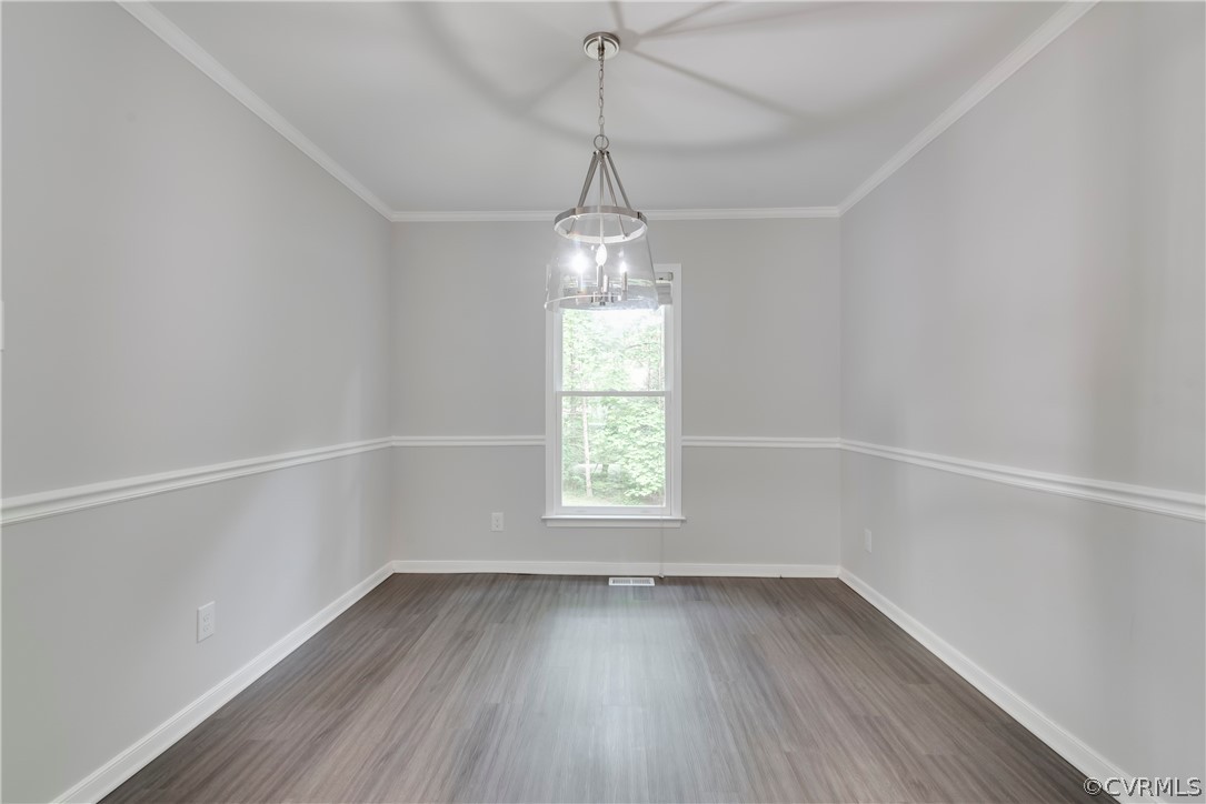 2618 Brookforest Road Midlothian, VA 23112 - Photo 5 of 29 a view of an empty room with wooden floor and a window