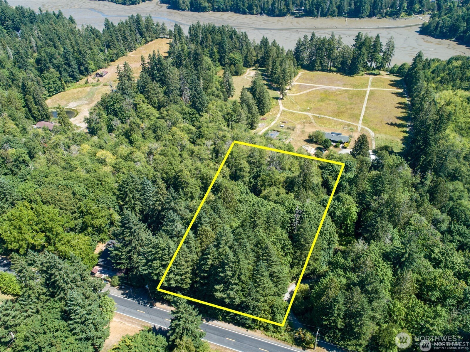 4510 Sleater Kinney Road Northeast Olympia, WA 98506 - Photo 2 of 10 an aerial view of a tennis ground with large trees