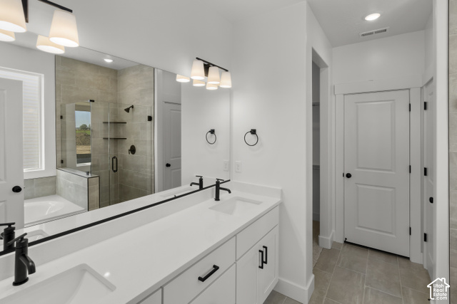 205 East 690th Street North Logan, UT 84321 - Photo 46 of 52 Dual vanity with white cabinetry, matte black hardware, and an expansive mirror
