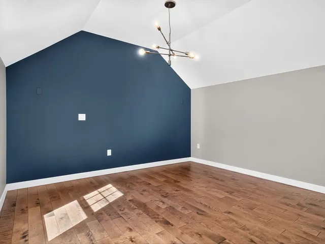 a bathroom with a granite countertop sink a toilet and mirror