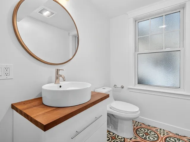 a bathroom with a sink a toilet and a bathtub