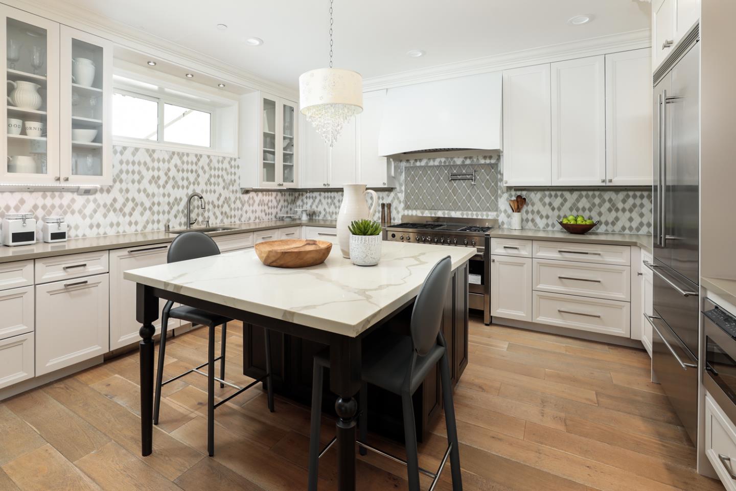 139 Windsor Drive San Carlos, CA 94070 - Photo 14 of 41 a kitchen with a table chairs sink and cabinets