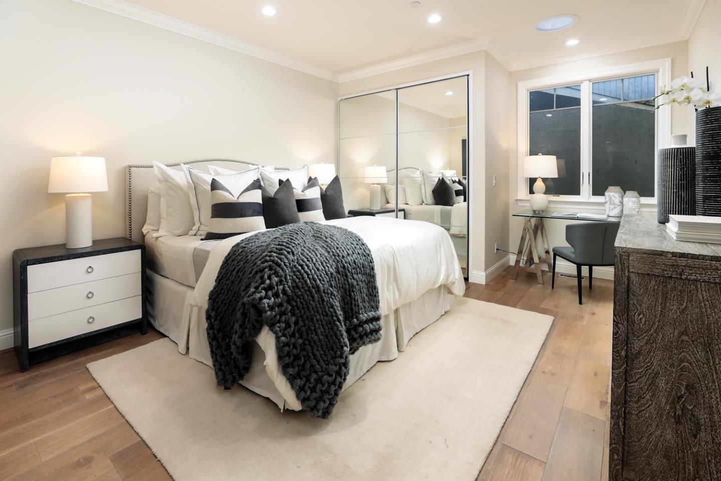 139 Windsor Drive San Carlos, CA 94070 - Photo 17 of 41 a spacious bedroom with a bed a table and chairs