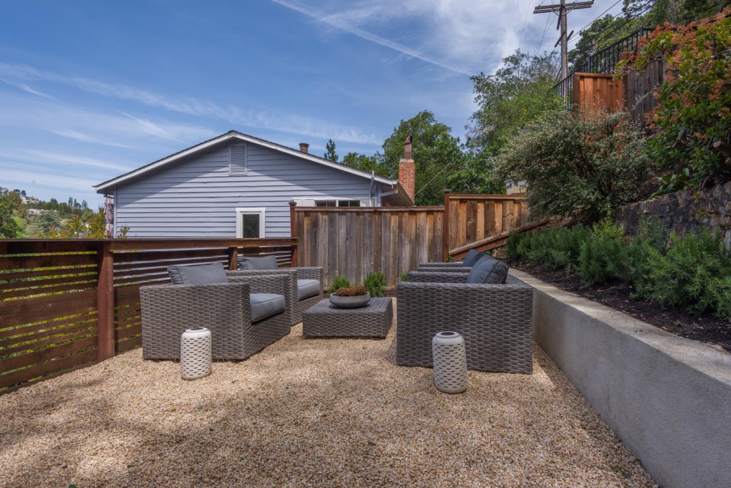 139 Windsor Drive San Carlos, CA 94070 - Photo 39 of 41 a view of a patio with couches chairs potted plants and wooden fence