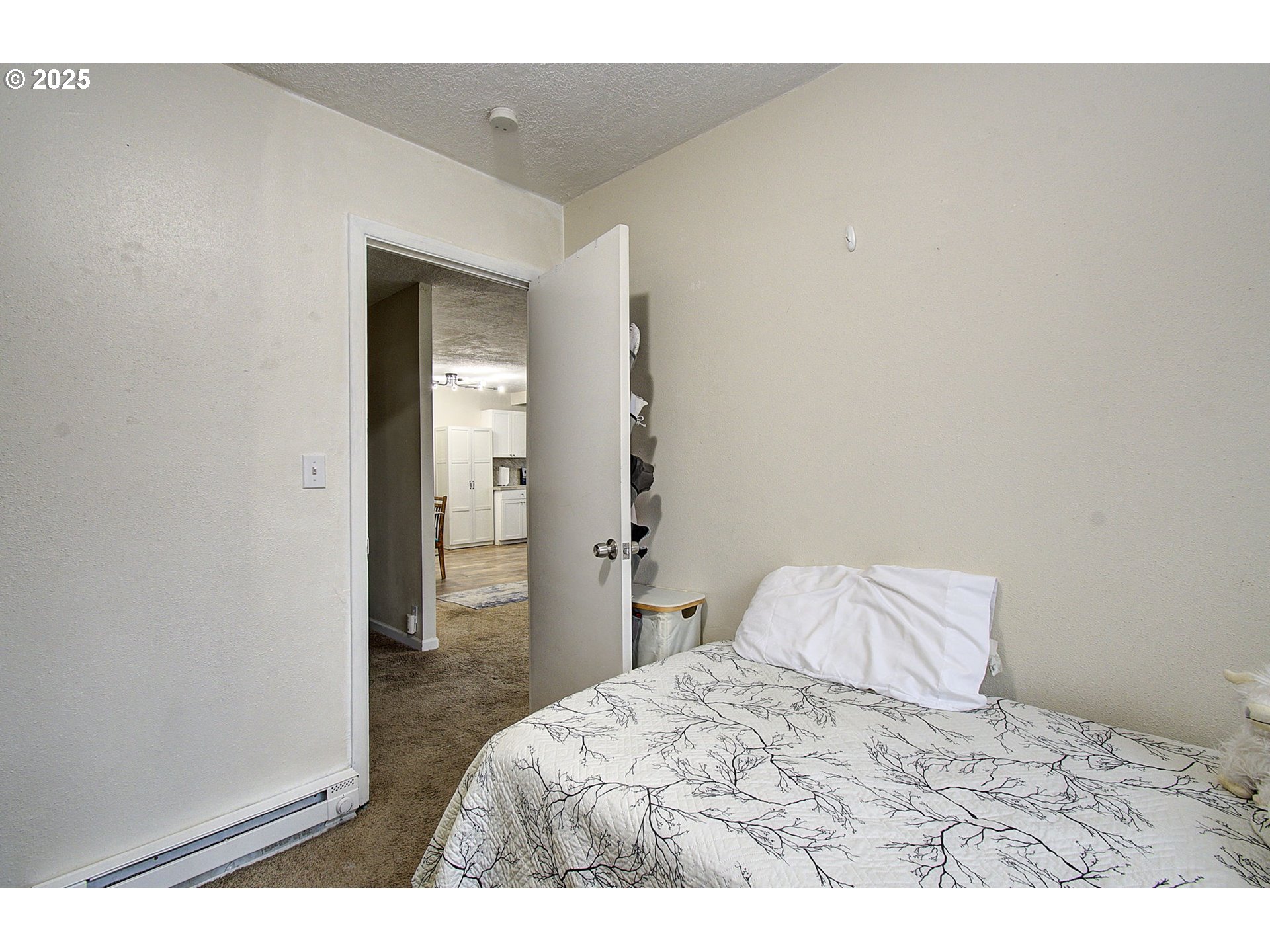 511 4th Avenue Southwest Castle Rock, WA 98611 - Photo 15 of 37 a bedroom with a bed and hallway
