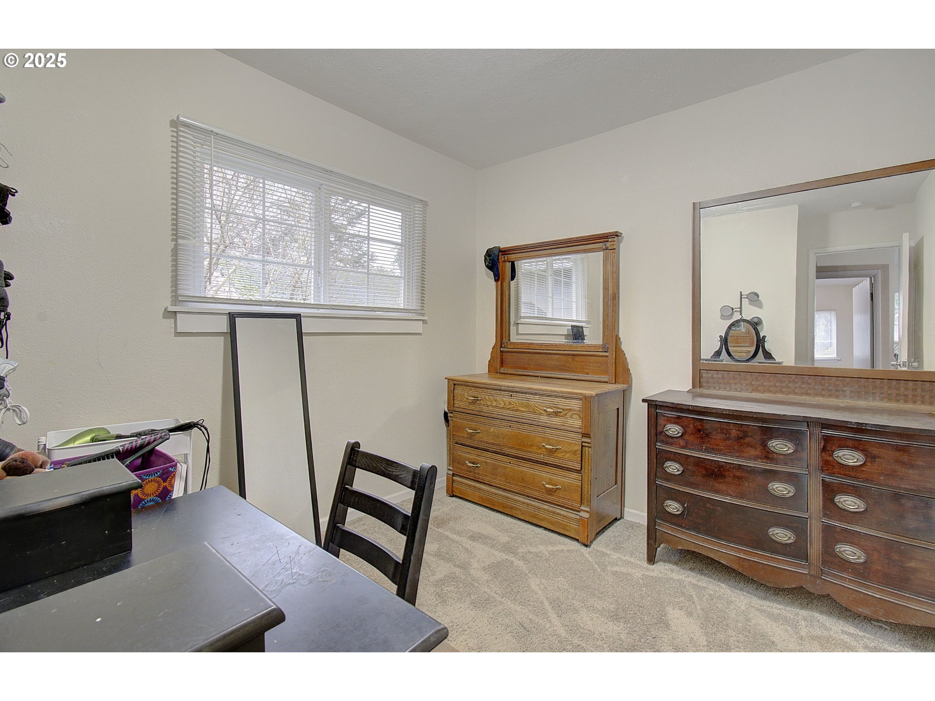 511 4th Avenue Southwest Castle Rock, WA 98611 - Photo 16 of 37 a bedroom with a bed and a dresser in it