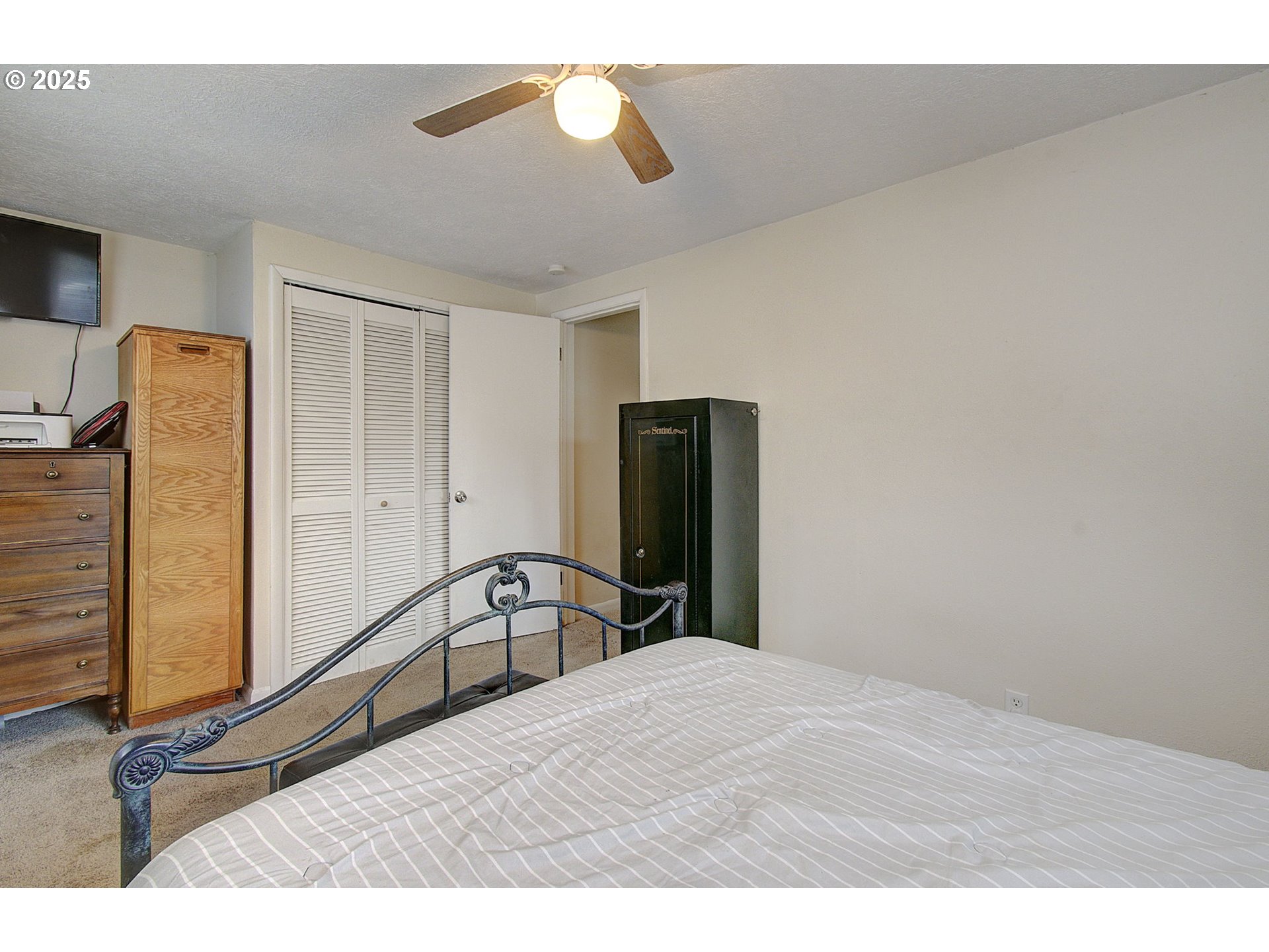 511 4th Avenue Southwest Castle Rock, WA 98611 - Photo 19 of 37 a bedroom with a bed and wooden floor