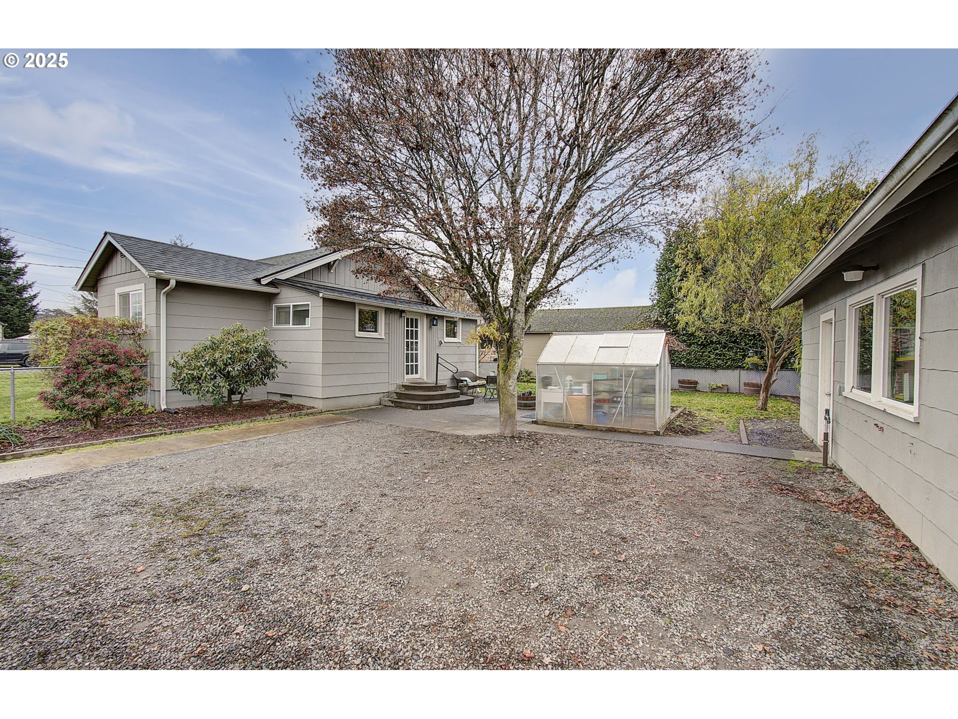 511 4th Avenue Southwest Castle Rock, WA 98611 - Photo 32 of 37 a view of a house with a backyard