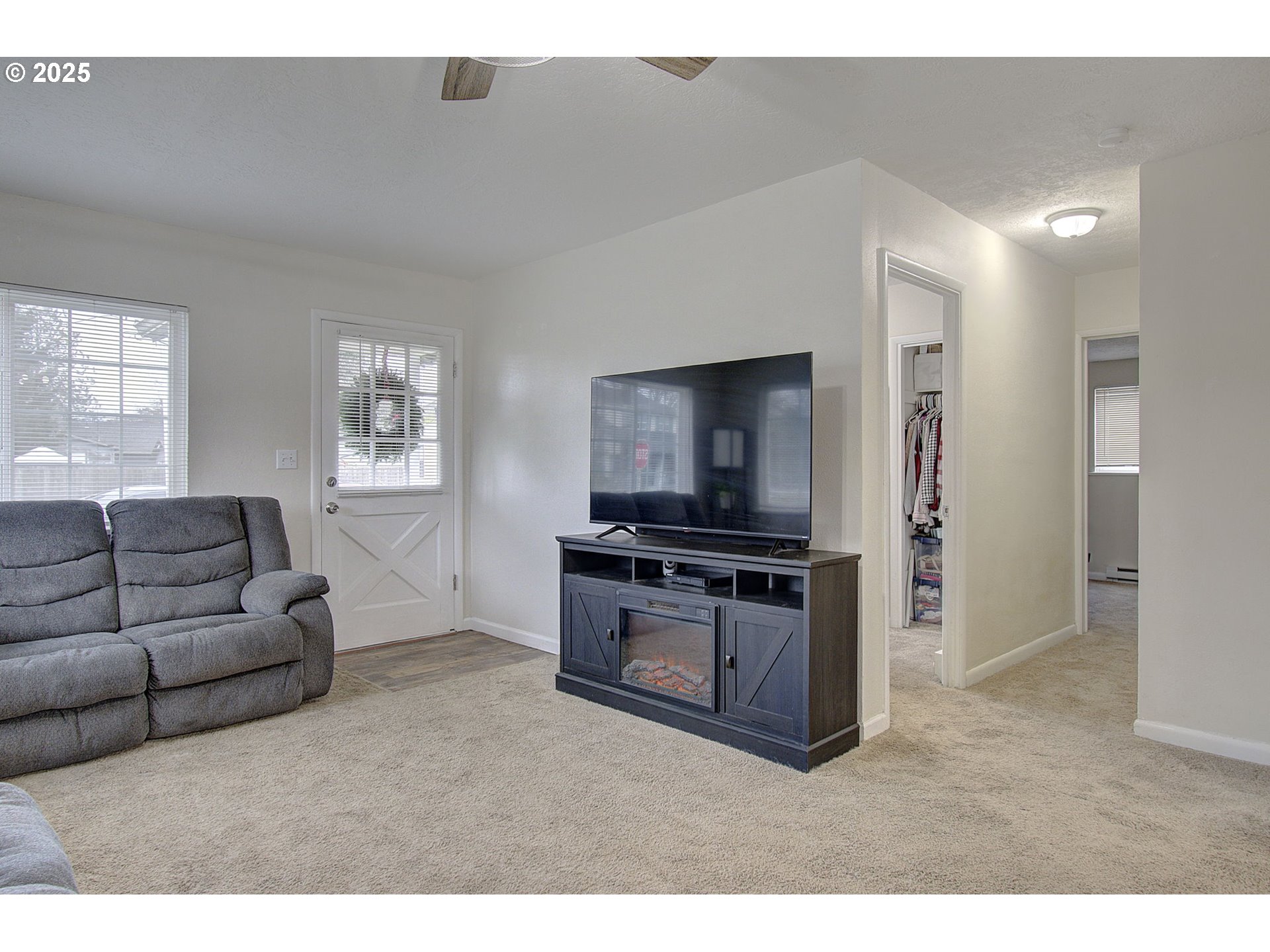 511 4th Avenue Southwest Castle Rock, WA 98611 - Photo 5 of 37 a living room with furniture and a flat screen tv
