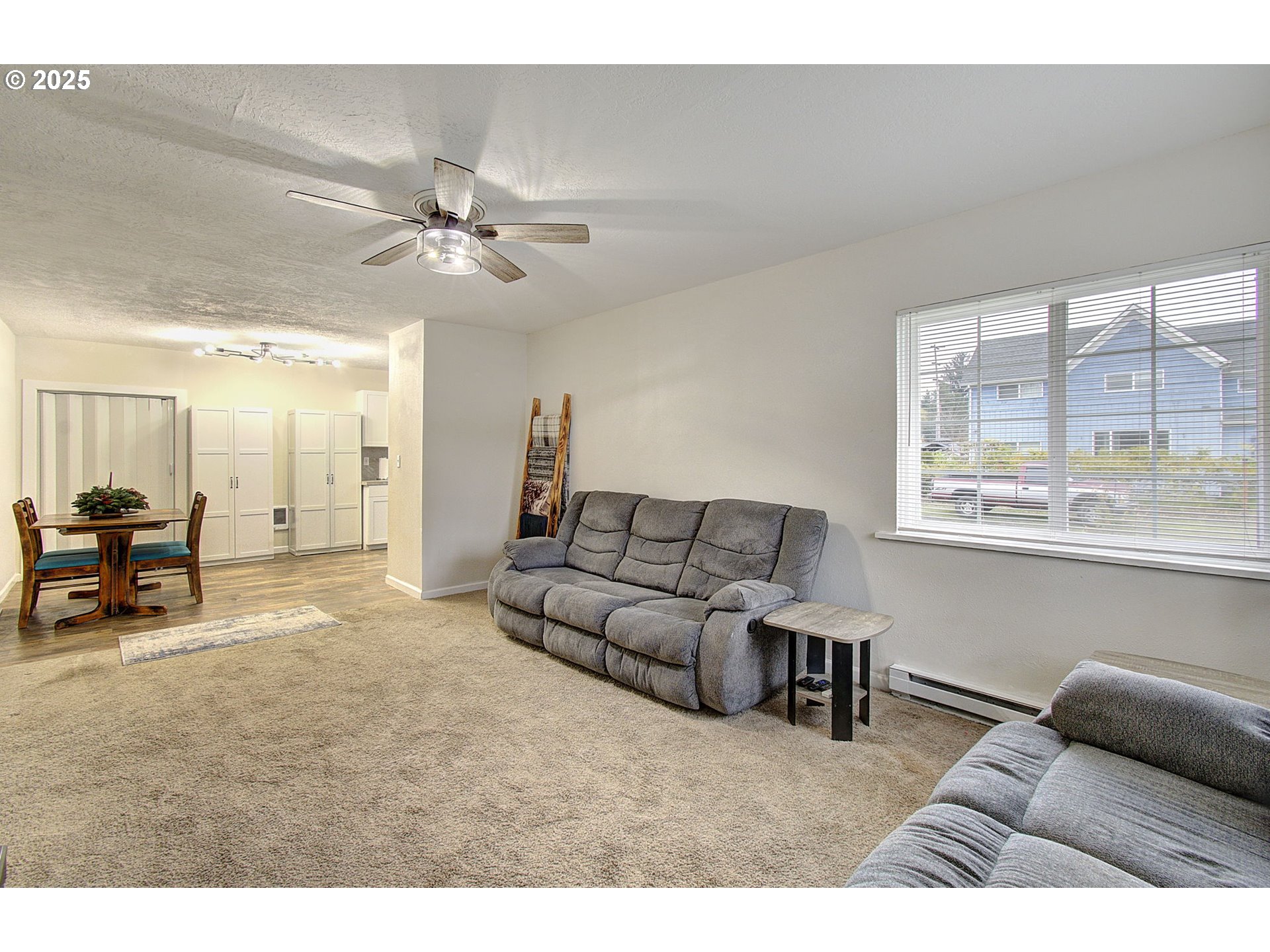 511 4th Avenue Southwest Castle Rock, WA 98611 - Photo 7 of 37 a living room with furniture and a large window