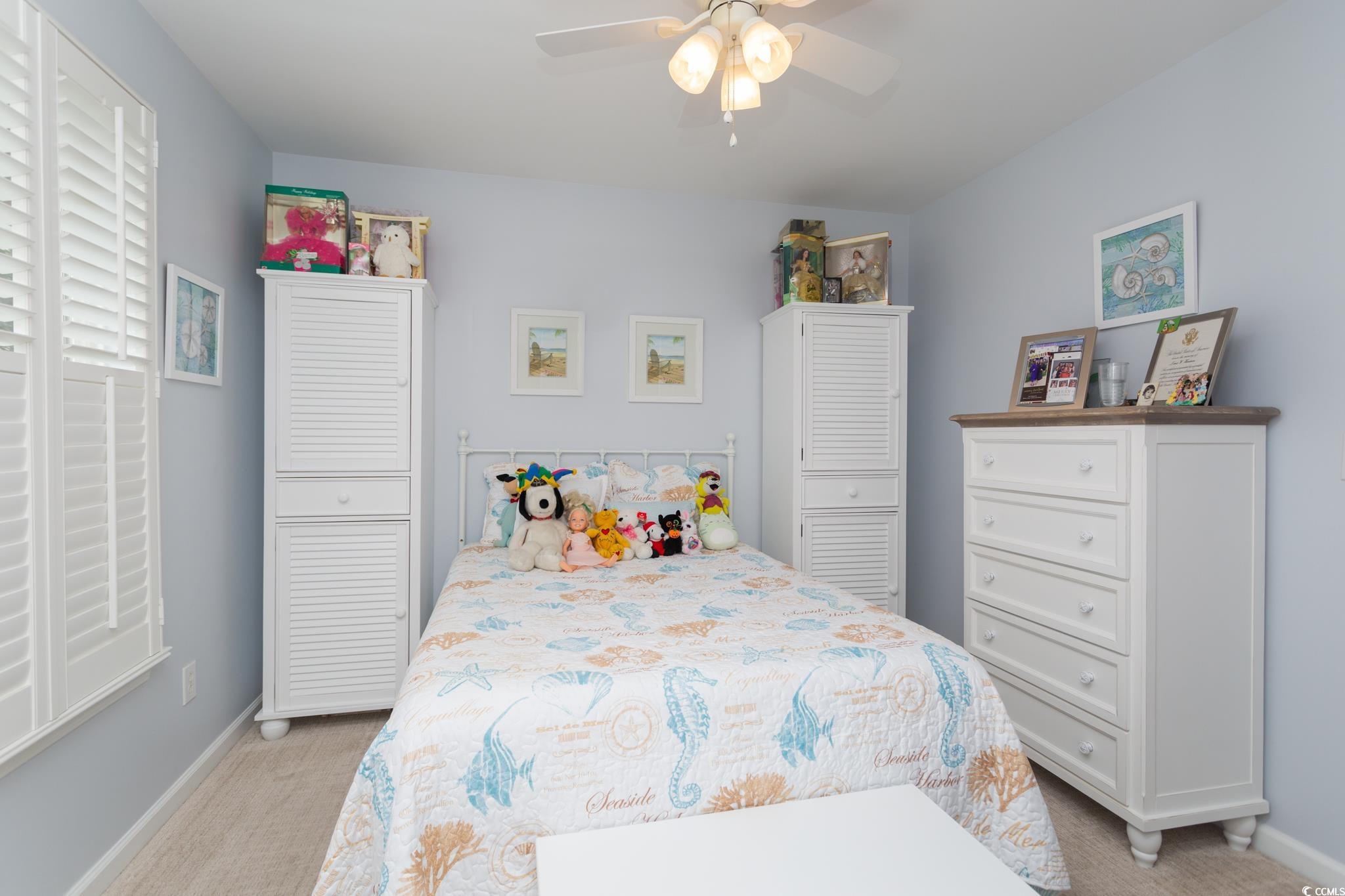 4502 Wintersweet Lane Murrells Inlet, SC 29576 - Photo 14 of 29 Carpeted bedroom with ceiling fan and a closet