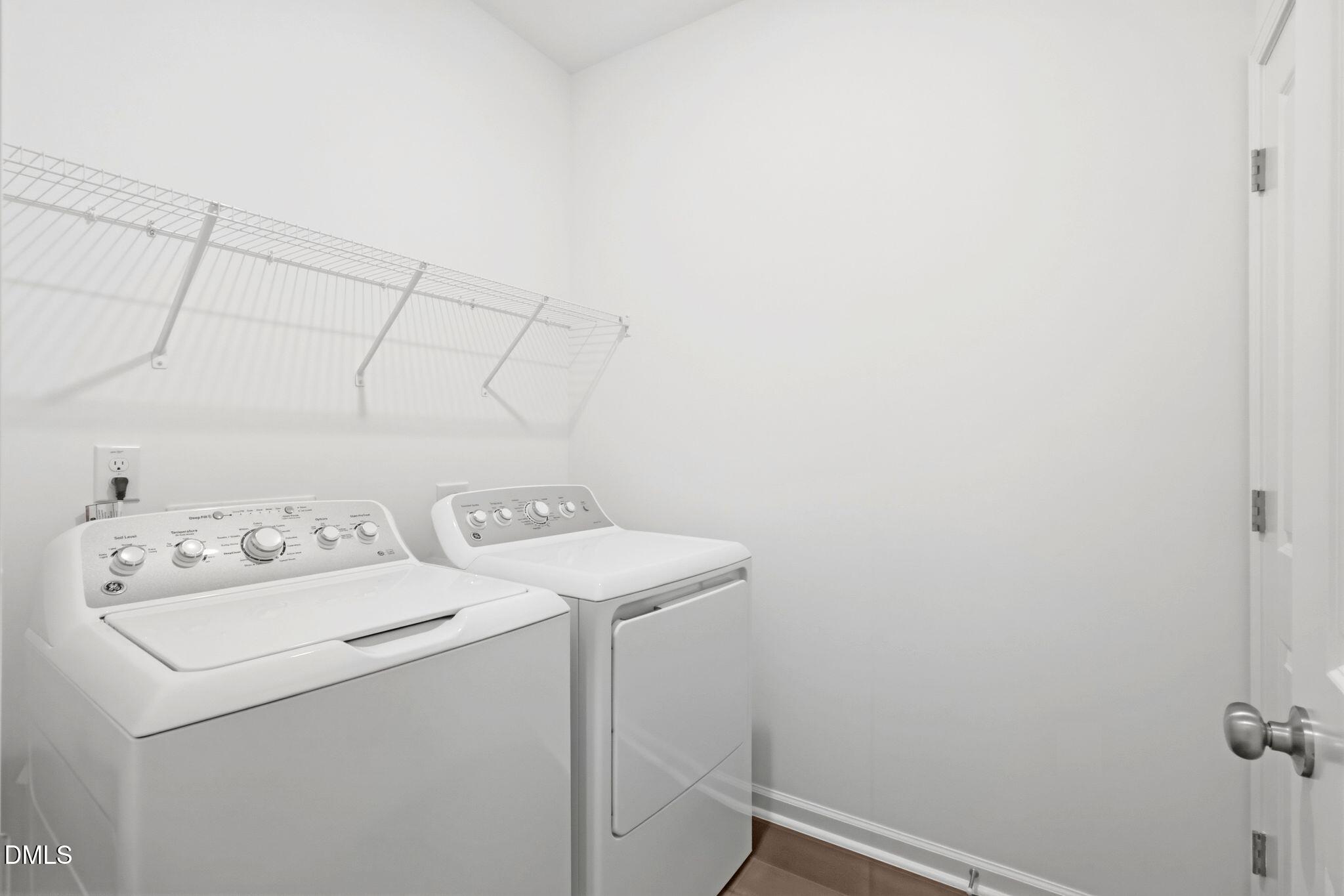 155 Digging Time Avenue Princeton, NC 27569 - Photo 25 of 29 a utility room with dryer and washer