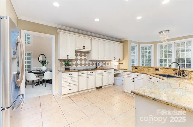 a kitchen with a sink cabinets and window