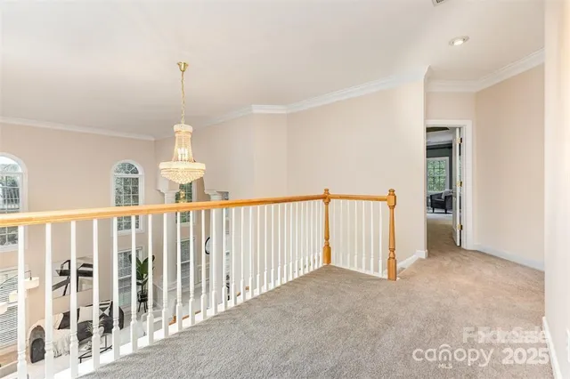 a view of staircase with kitchen view