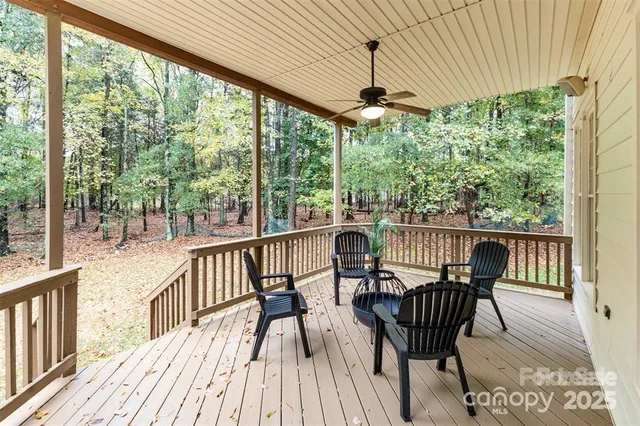 a view of a two chairs and table in the deck