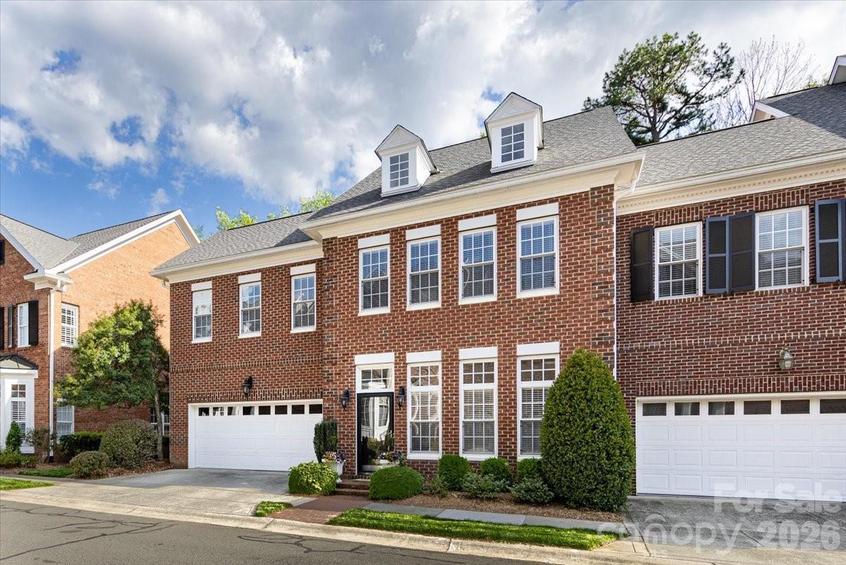 6415 Wakehurst Road Charlotte, NC 28226 - Photo 3 of 48 a front view of a building with a garden