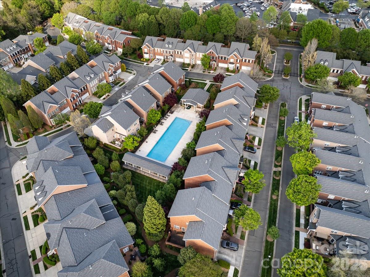 6415 Wakehurst Road Charlotte, NC 28226 - Photo 44 of 48 an aerial view of a residential apartment building with plants and large trees