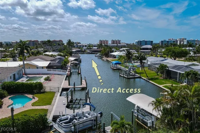 a view of a lake with a table and chairs