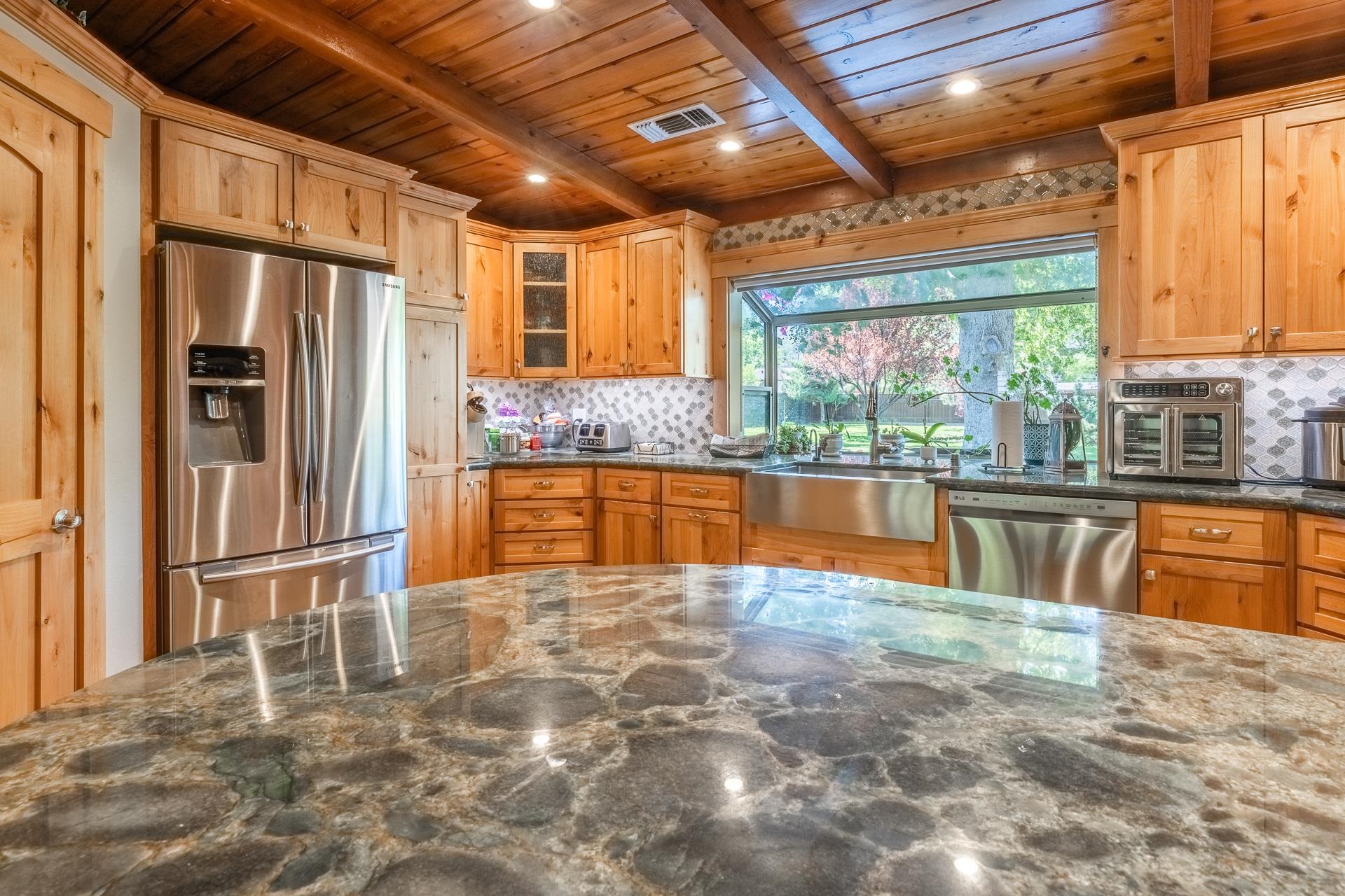 325 Mt Tom Road Bishop, CA 93514 - Photo 12 of 33 a view of a kitchen with stainless steel appliances granite countertop a refrigerator and a sink