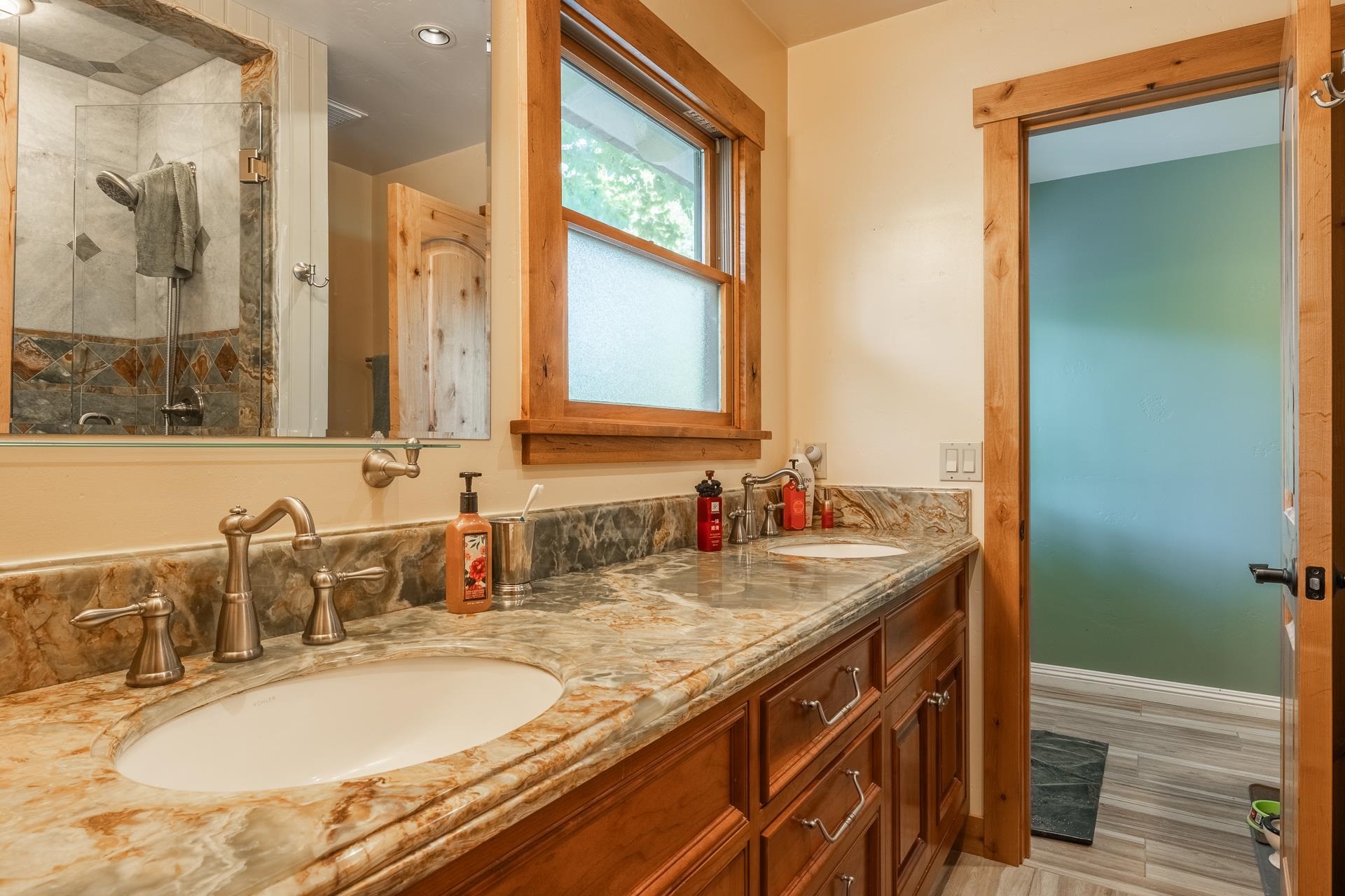 325 Mt Tom Road Bishop, CA 93514 - Photo 20 of 33 a bathroom with a granite countertop sink and a mirror