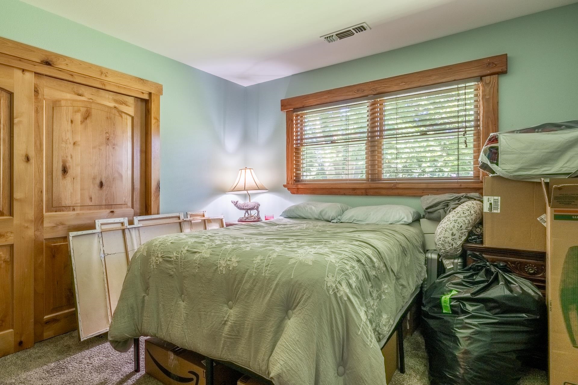 325 Mt Tom Road Bishop, CA 93514 - Photo 22 of 33 a bed sitting in a bedroom next to a window