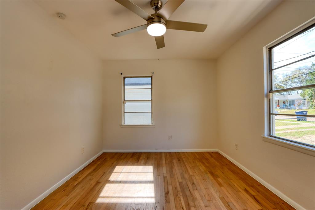 4520 Utah Avenue Dallas, TX 75216 - Photo 14 of 27 wooden floor in an empty room with a window