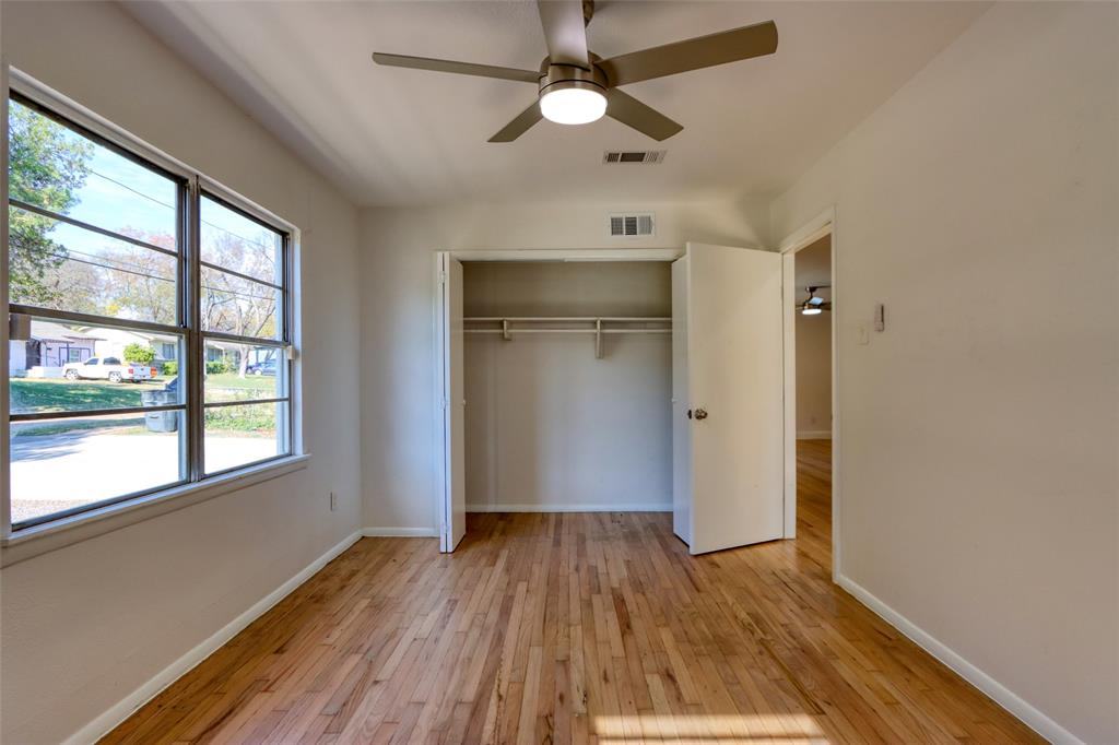 4520 Utah Avenue Dallas, TX 75216 - Photo 15 of 27 wooden floor in an empty room with a window