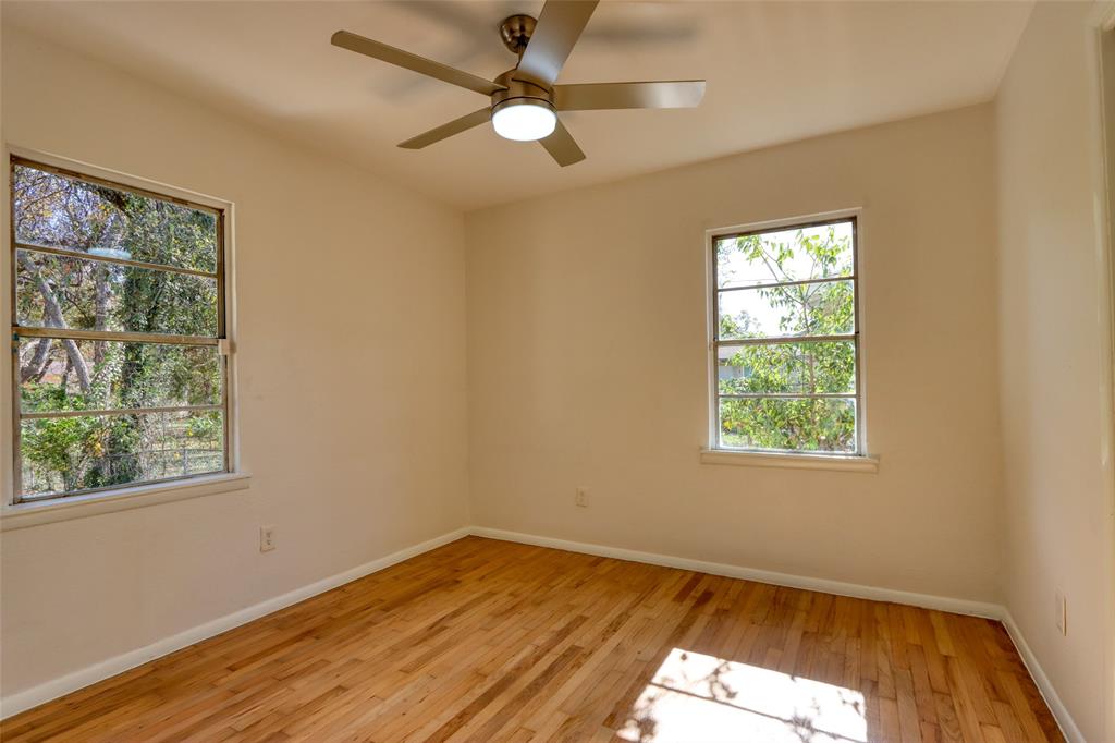4520 Utah Avenue Dallas, TX 75216 - Photo 20 of 27 a view of empty room with wooden floor and fan