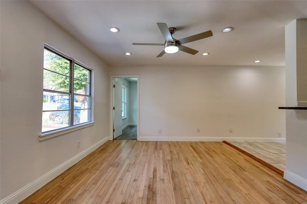 4520 Utah Avenue Dallas, TX 75216 - Photo 24 of 27 an empty room with wooden floor fan and windows