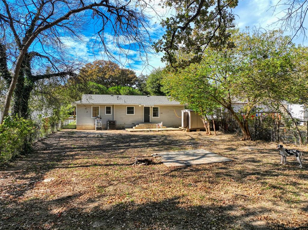 4520 Utah Avenue Dallas, TX 75216 - Photo 26 of 27 a front view of house with yard and trees