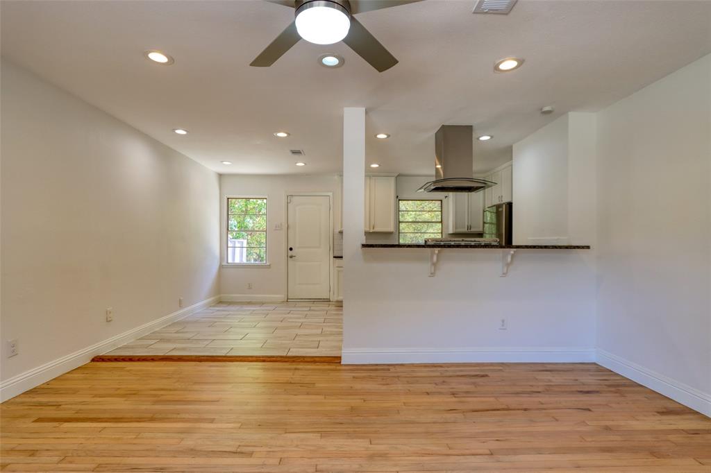 4520 Utah Avenue Dallas, TX 75216 - Photo 3 of 27 a view of a kitchen with a sink and a chandelier