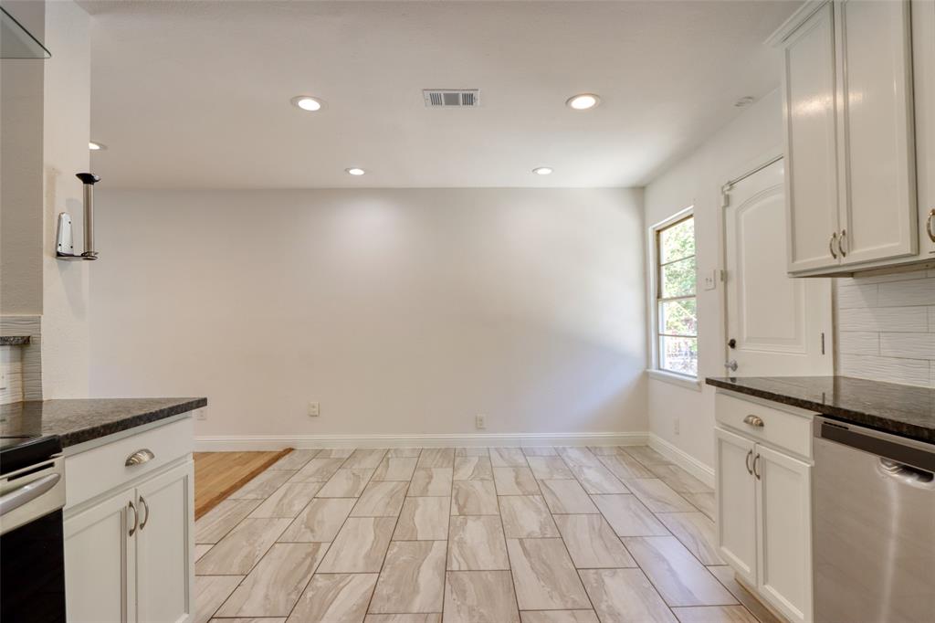 4520 Utah Avenue Dallas, TX 75216 - Photo 6 of 27 a view of a kitchen with a sink and dishwasher with wooden floor