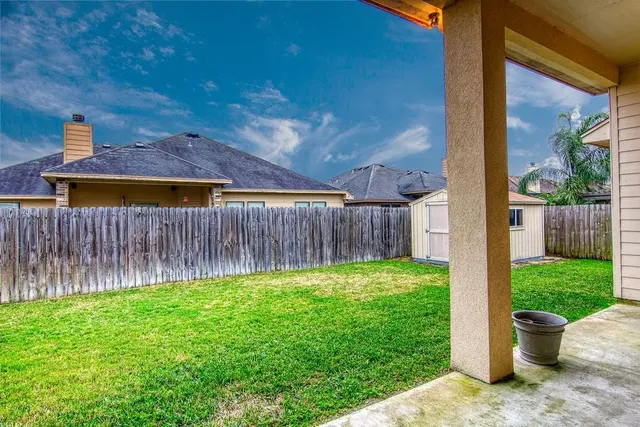 a backyard of a house with lots of green space