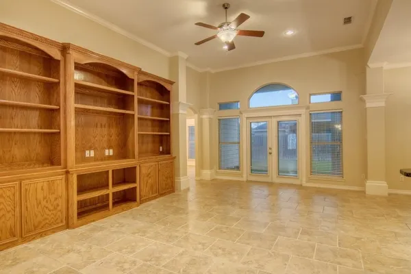 a view of an empty room with a window